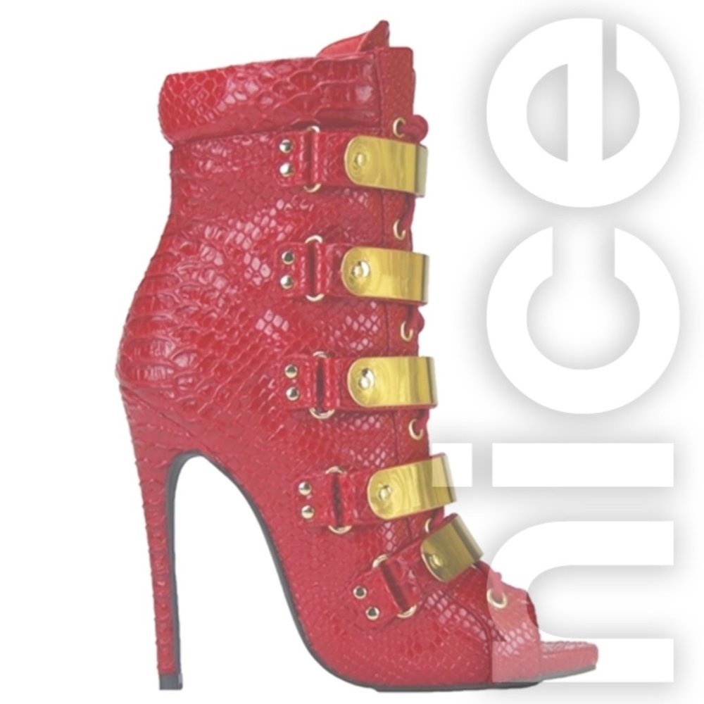NELLY BERNAL ON FLEEK RED SNAKE BOOTIES